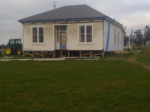 The weatherboard house in position, ready to be fixed up and lived in