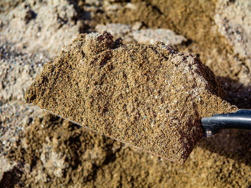 Natural River Sand close up in a shovel