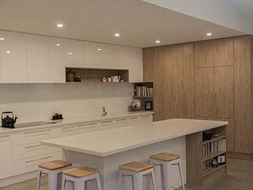 Kitchen with kitchen island seating and cookbook storage