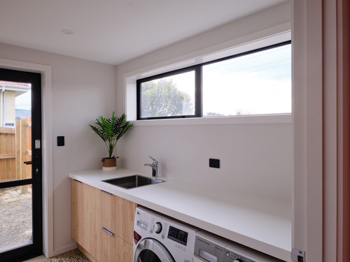 Laundry storage with sink and windows