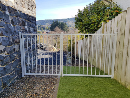 White gate to secure the side of the house