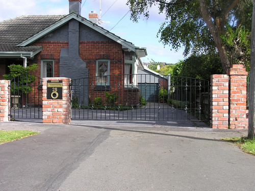 Decorative iron driveway gate