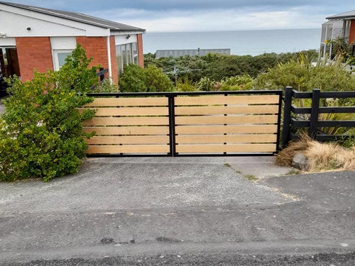 Wood and metal gate by Otago Engineering