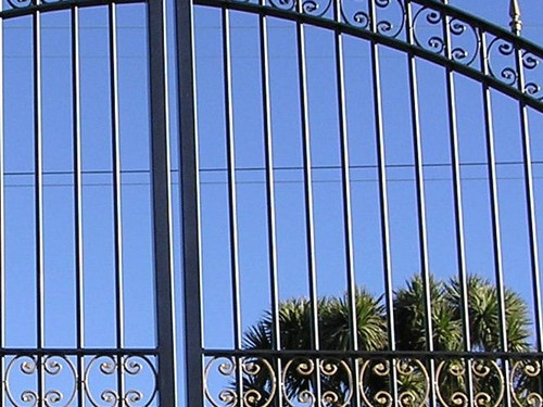 Wrought iron gate in a classic arch shape