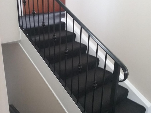 Black handrail on stairs