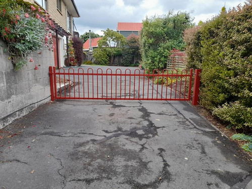 Red automatic gate by Otago Engineering