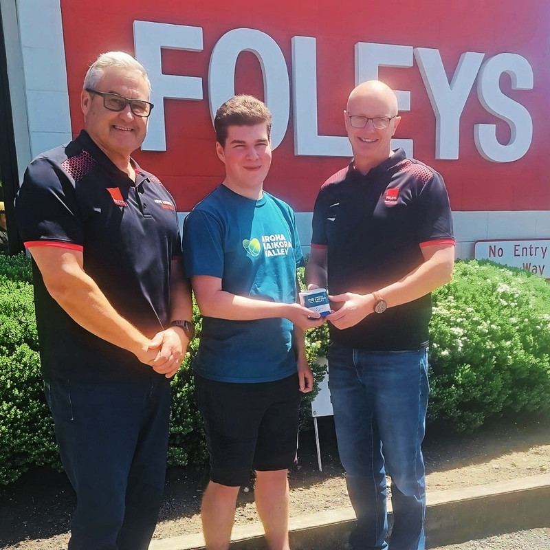 AKV member handing over air quality monitor to Foleys staff member