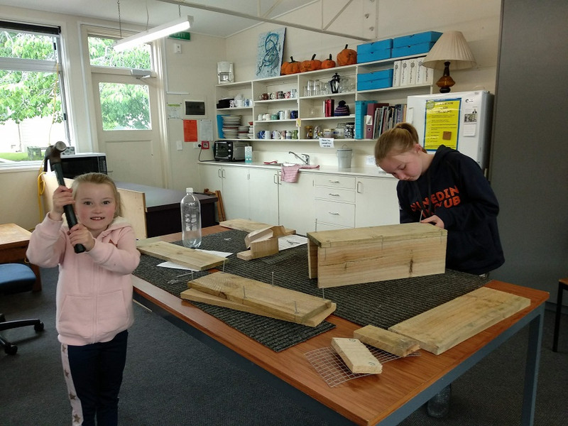 Elsie and Bella Anderson making their trapbox.