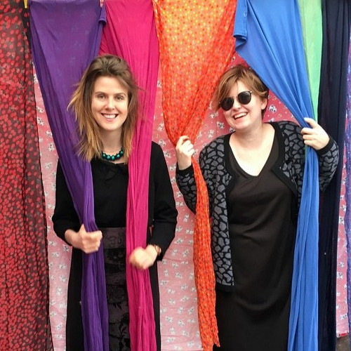 Franziska and Aileen try out some new styles as they sort clothes for the Opoho Church Fair on this Saturday.