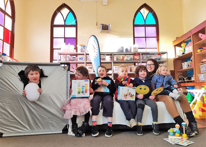 Children celebrate the arrival of new toys at the Dunedin City Toy Library including a dark den which gives children a chill out space in a busy world.