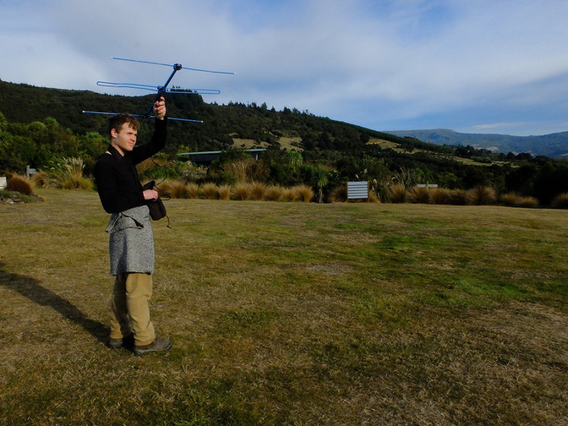Scott using a radio aerial to track kākā. Photo: Charlotte Patterson