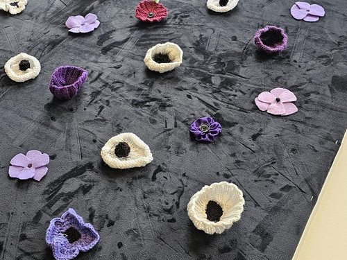 Placing the pretty purple and white poppies first
