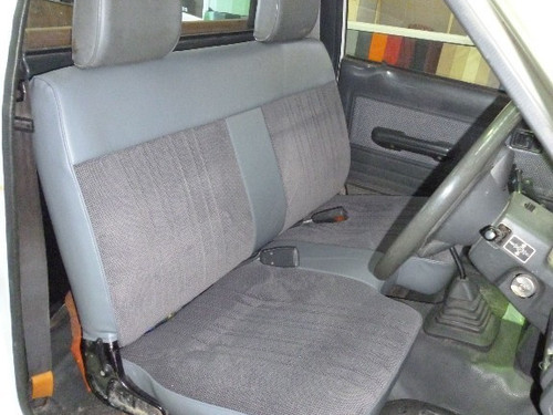 After. Now with the padding repaired and new covers on the cushion and backrest the bench seat looks brand new.