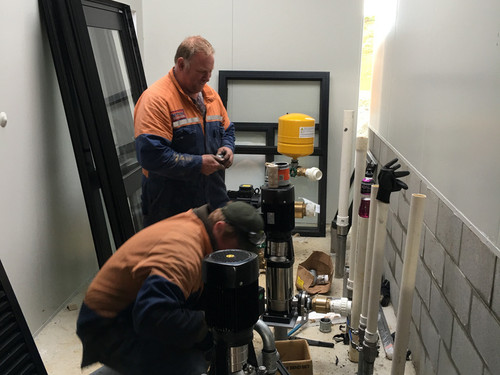 Doug and Ethan installing the water pumps at Arrow Dairies