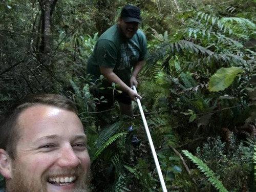 Tristan and Et (Nind Dairy Services staff) making their way through the bush marking out the pipeline