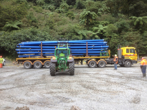 Unloading the pipes for Deep Cove - no easy task at over 200kg each