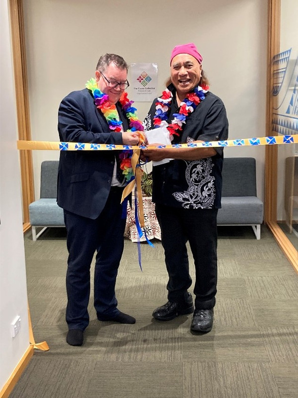 The image shows University of Otago Vice Chancellor Grant Robertson and Cause Collective Chairman Dr Uluomato’otua Saulaulu Aiono together cutting a ribbon across a hallway. 
