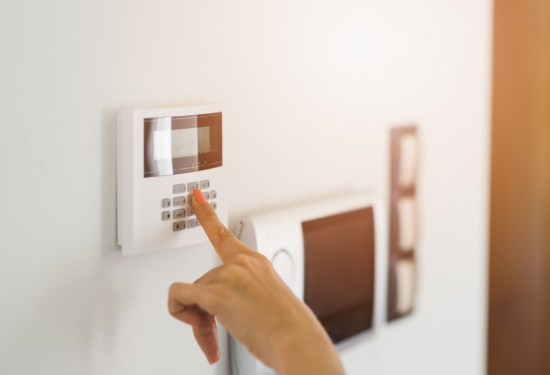 Keypad being used on alarm system.