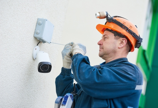 Nurse Call Plus technician installing CCTV.