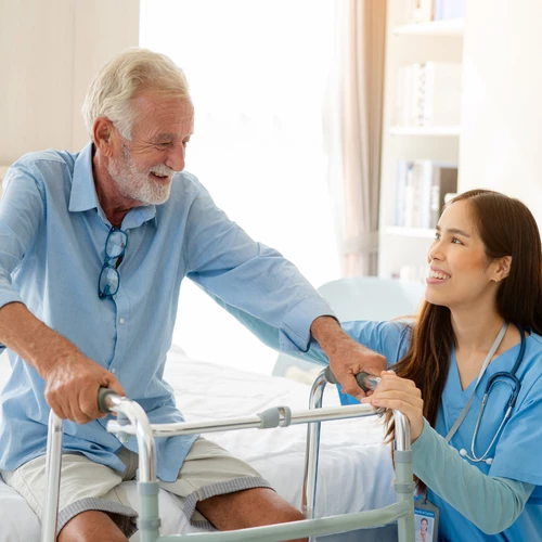 Elderly man comforted by nurse