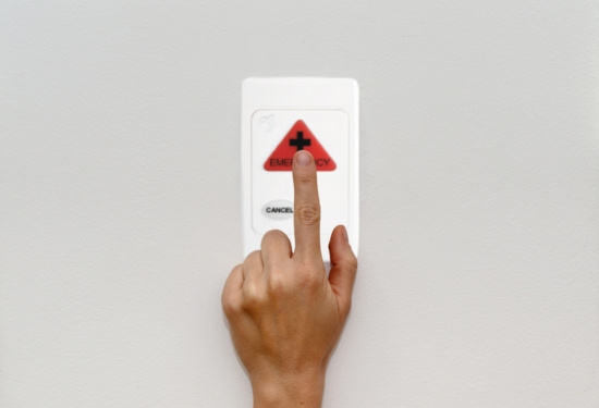 Assessibility alarm button being pressed