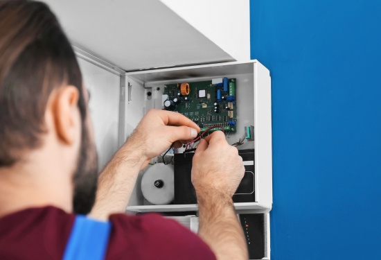 Man fixing  a nurse call system