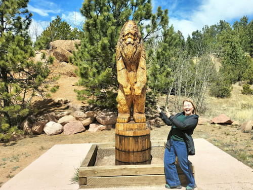 Jenny beside the Big Foot Statue at Pikes Peak