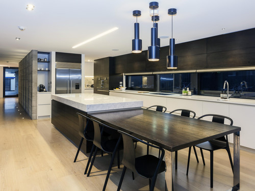The kitchen features marble, concrete and the finest quality hardware