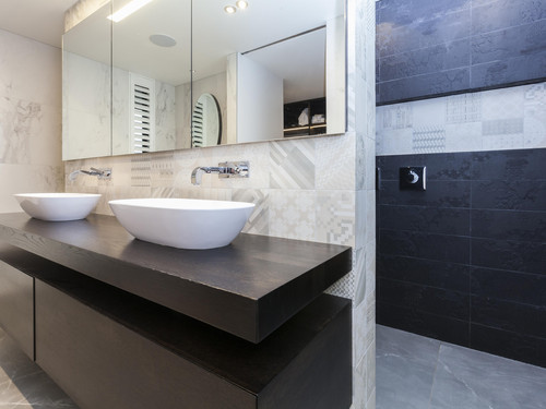 Mosaic tiles and textures add interest to the master bathroom
