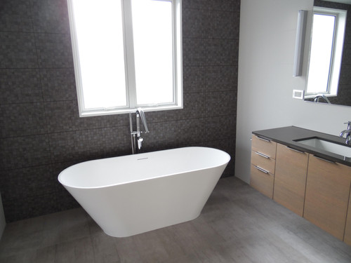 A modern bathtub makes a statement of luxury in the bathroom