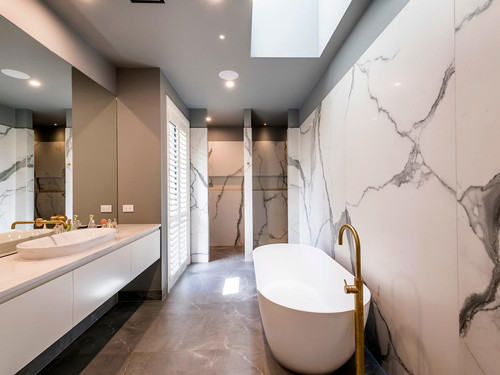 The Ohoka house bathroom features extensive use of marble tile's.