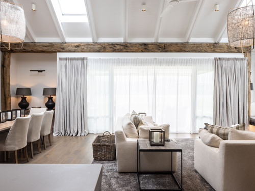 The French Oak beams and soft furnishings create a rustic comfort.