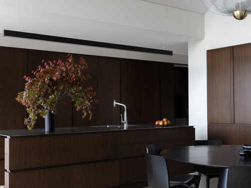 With interior design by Lume Design the dark chocolate interiors add warmth