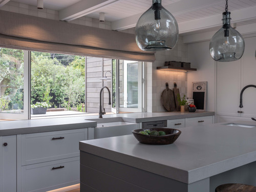 Pendant lighting, stone bench tops are key aspects to this character kitchen.