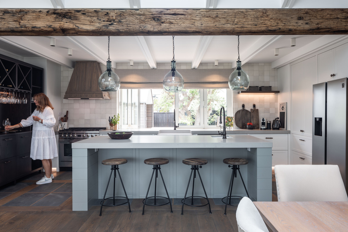 The French Oak beams, Grooved plywood ceilings and timber ceiling rafters add beautiful texture to the kitchen.