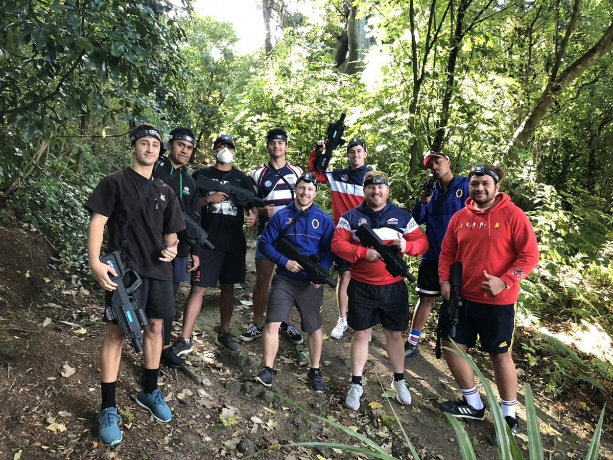A great crew after a fun game of Battle Combat in the bush around Dunedin