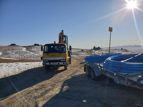 The May Plumbing & Gas team transporting an excavator to the remote site