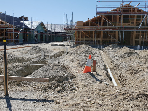 The buildings going up as the drainage on the next site begins