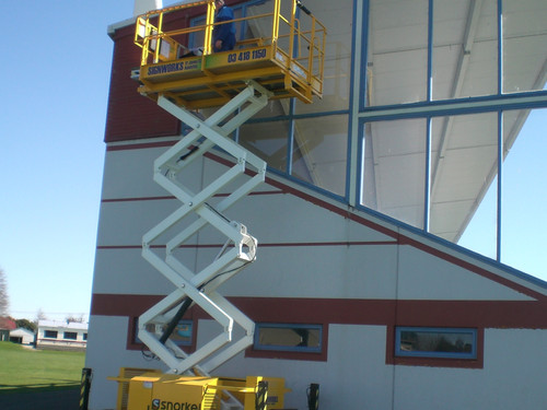 Easily clean spouting with the scissor lift hire from Signworks Balclutha